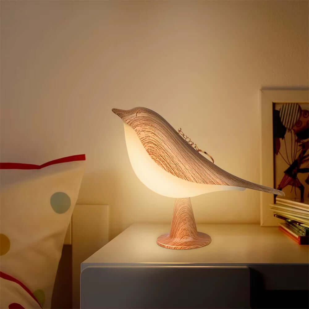 FeatherGlow Bird Lamp casting a warm glow in a modern bedroom, showcasing elegance and cozy ambiance.