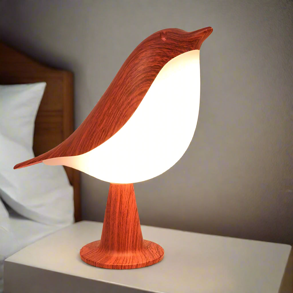 Elegant FeatherGlow Bird Lamp providing a cozy, modern ambiance in a stylish bedroom setting.